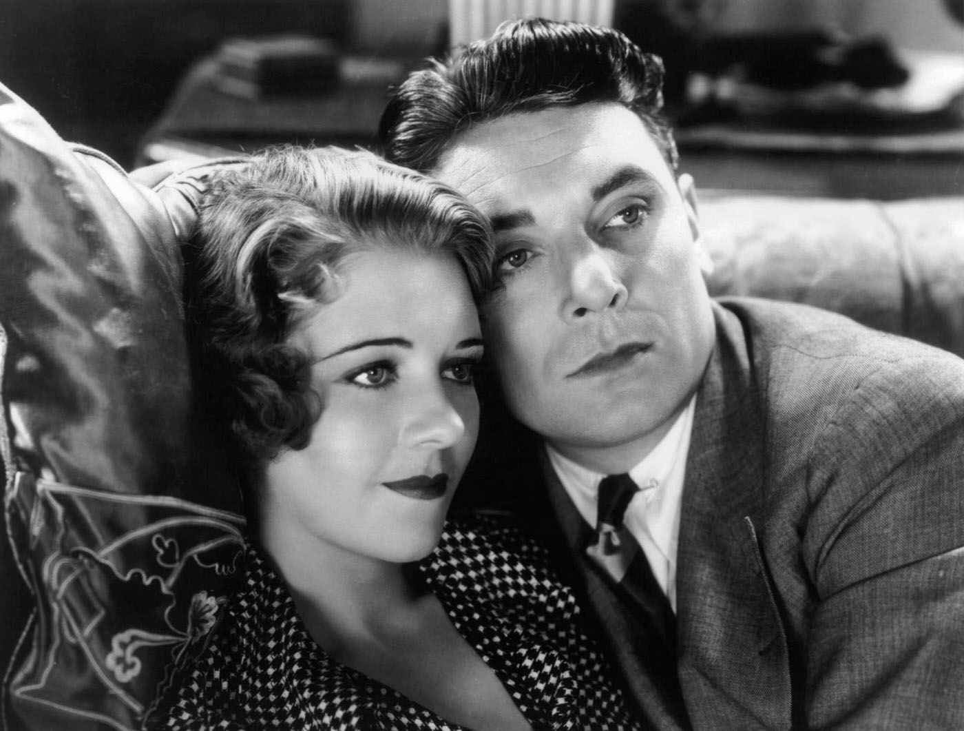 Ruby Keeler And George Brent Sitting Close Together On The Couch In A Scene From The Film '42Nd Street', 1933.