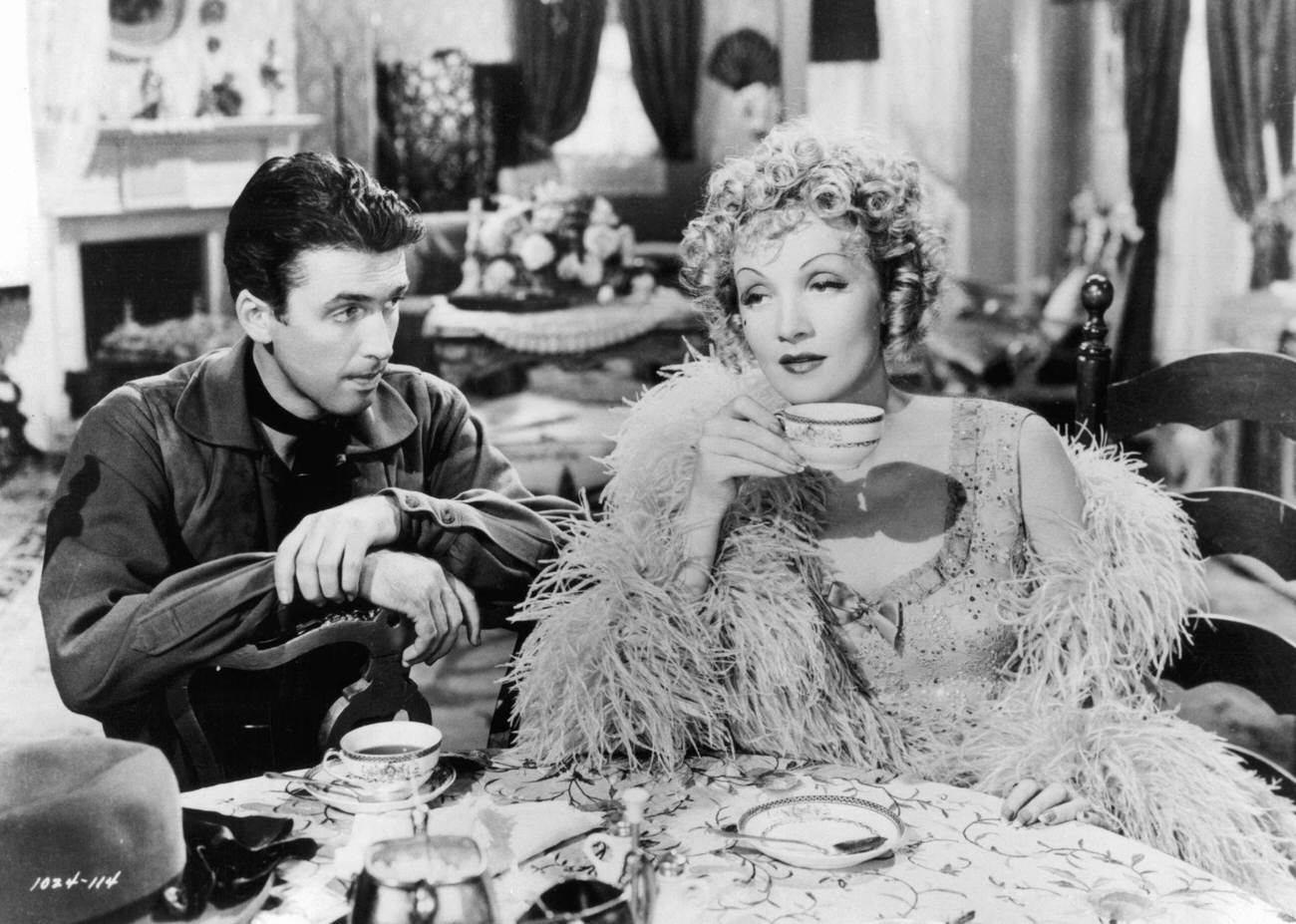 James Stewart Watching Marlene Dietrich Drink Her Tea In A Scene From The Film 'Destry Rides Again', 1939