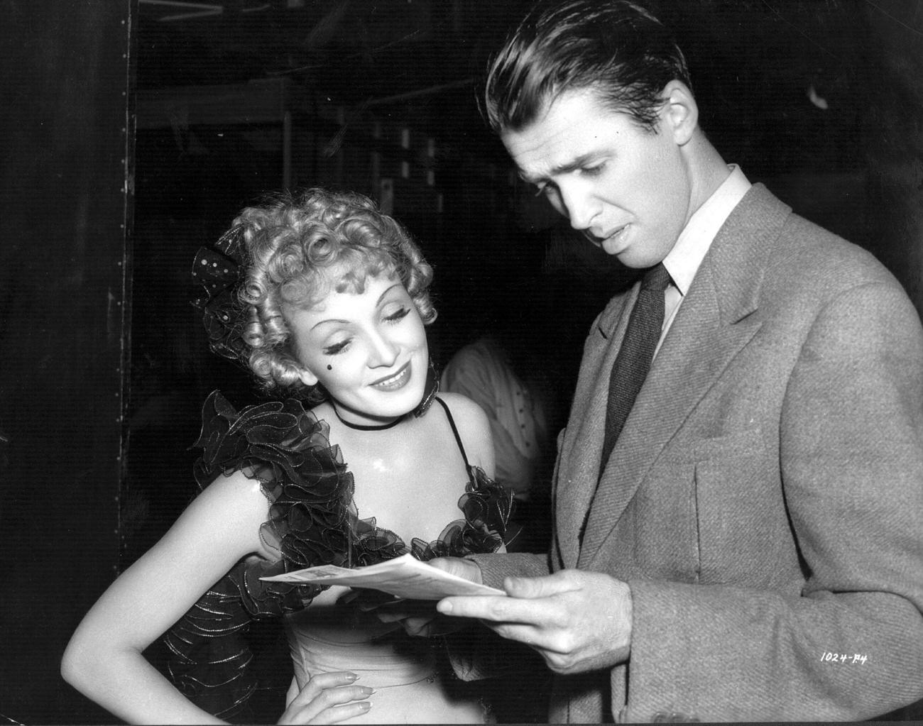 Marlene Dietrich And James Stewart Peruse The Script Of 'Destry Rides Again', Prior To Shooting A Scene.