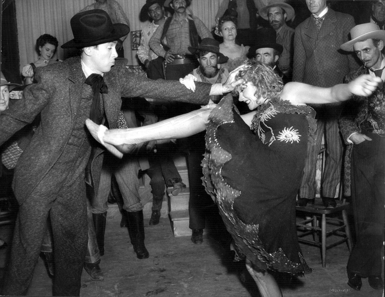 Marlene Dietrich Kicks Ineffectually At James Stewart During A Saloon Fight