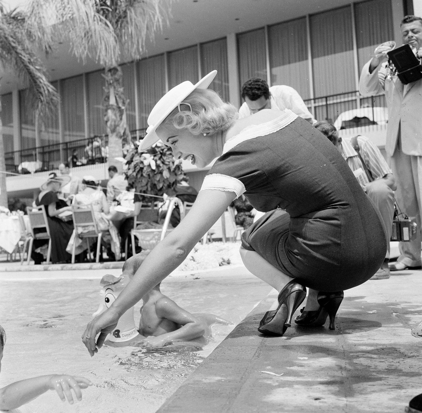 Celeste Holm, Children Attend Swim School Opening In Los Angeles On August 12, 1955