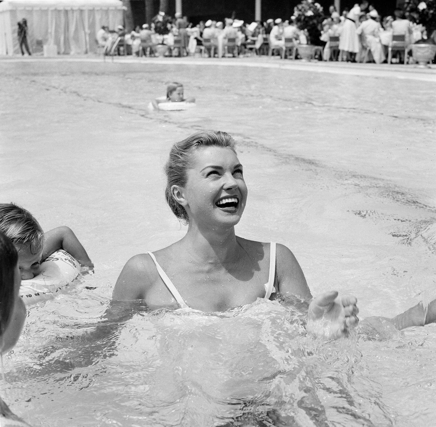 Esther Williams In The Pool With Children At Swim School Opening In Los Angeles On August 12, 1955