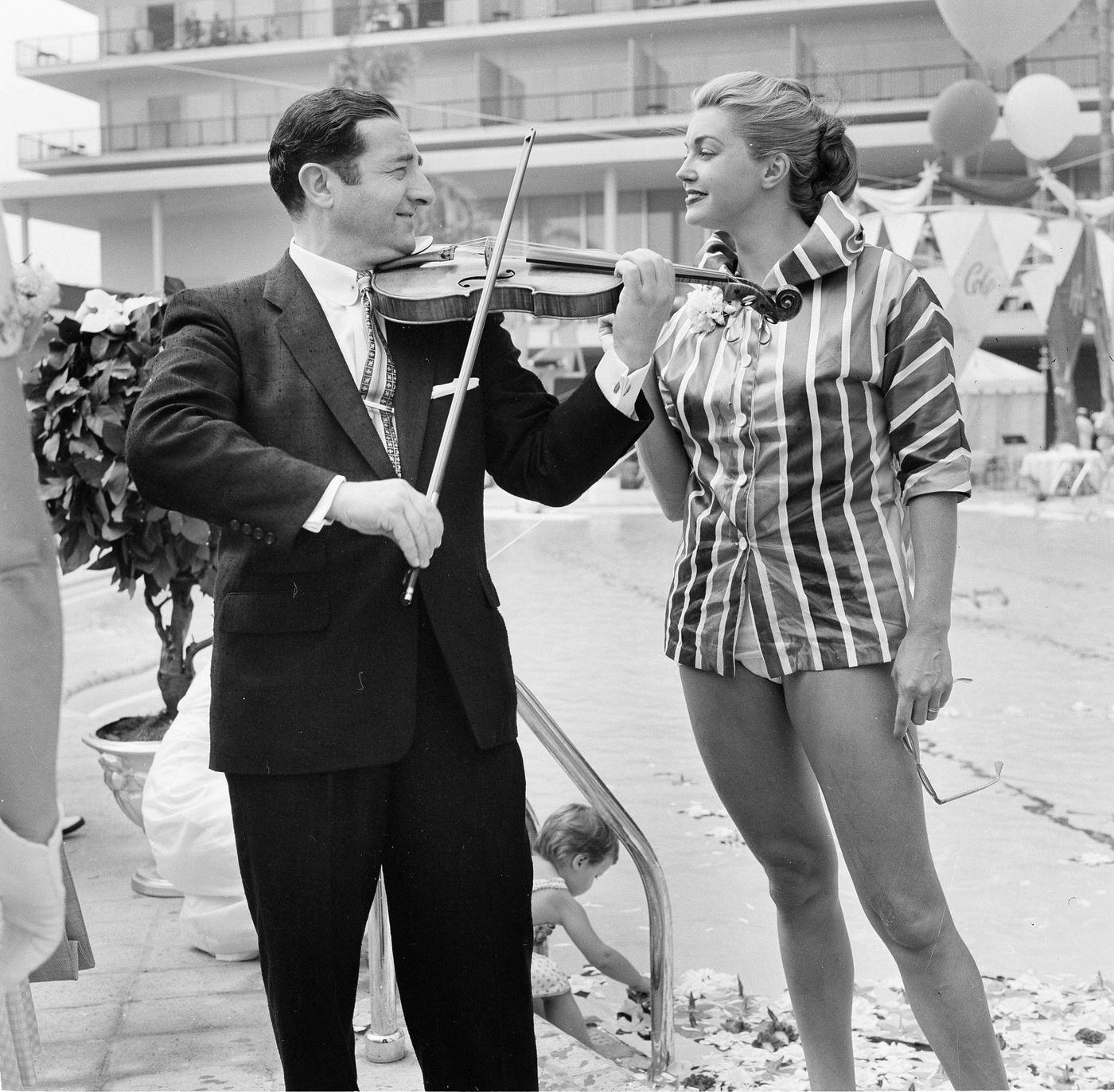 Esther Williams Serenaded At Swim School Opening In Los Angeles On August 12, 1955