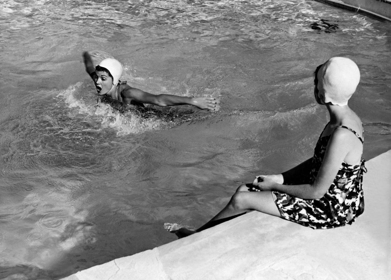 Esther Williams Showing Her Pupil Gay Pumphrey The Technique In The Butterfly Stroke, November 1951