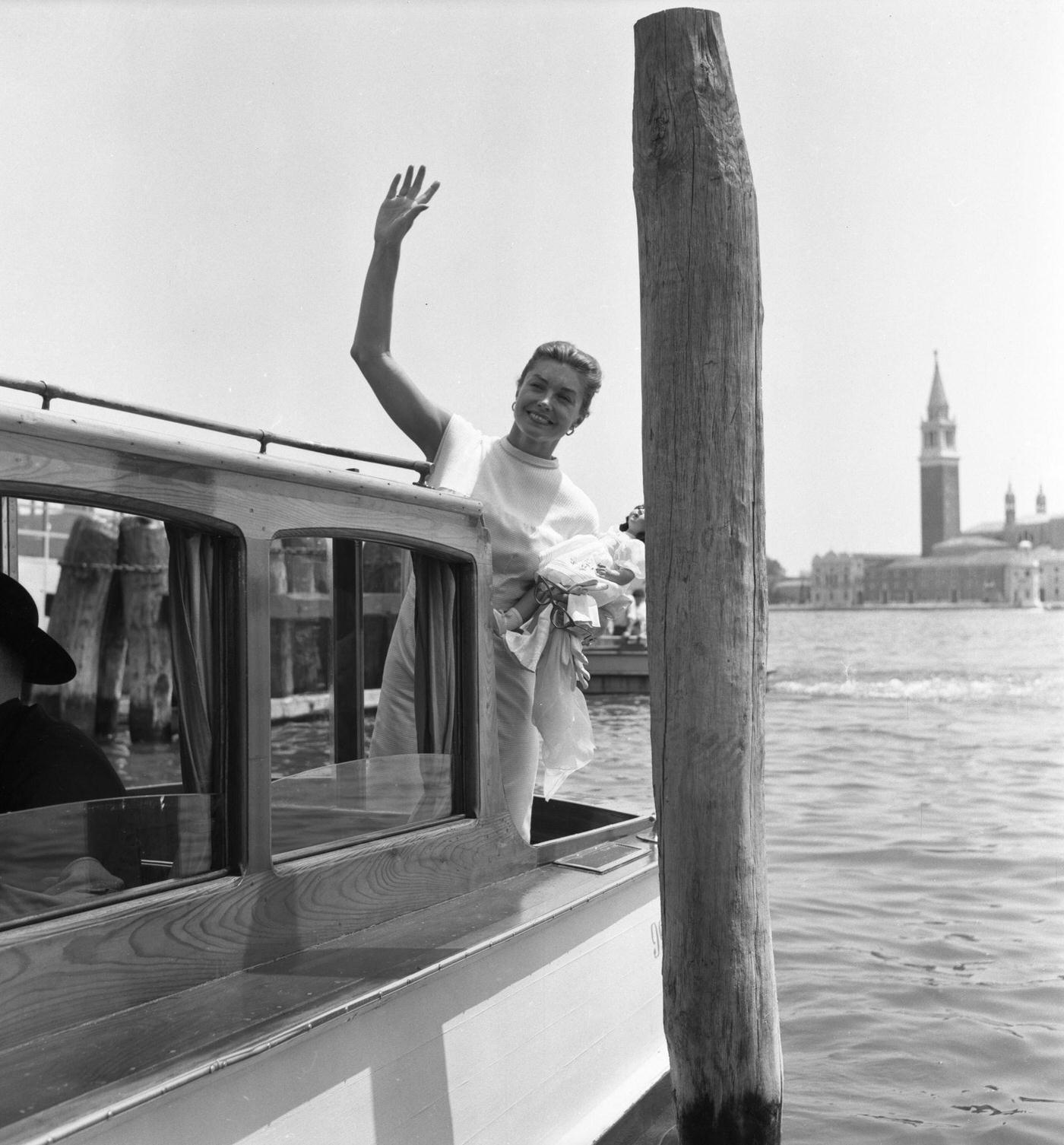 Esther Williams Waves From A Taxi Boat In Venice, Italy, September 1957
