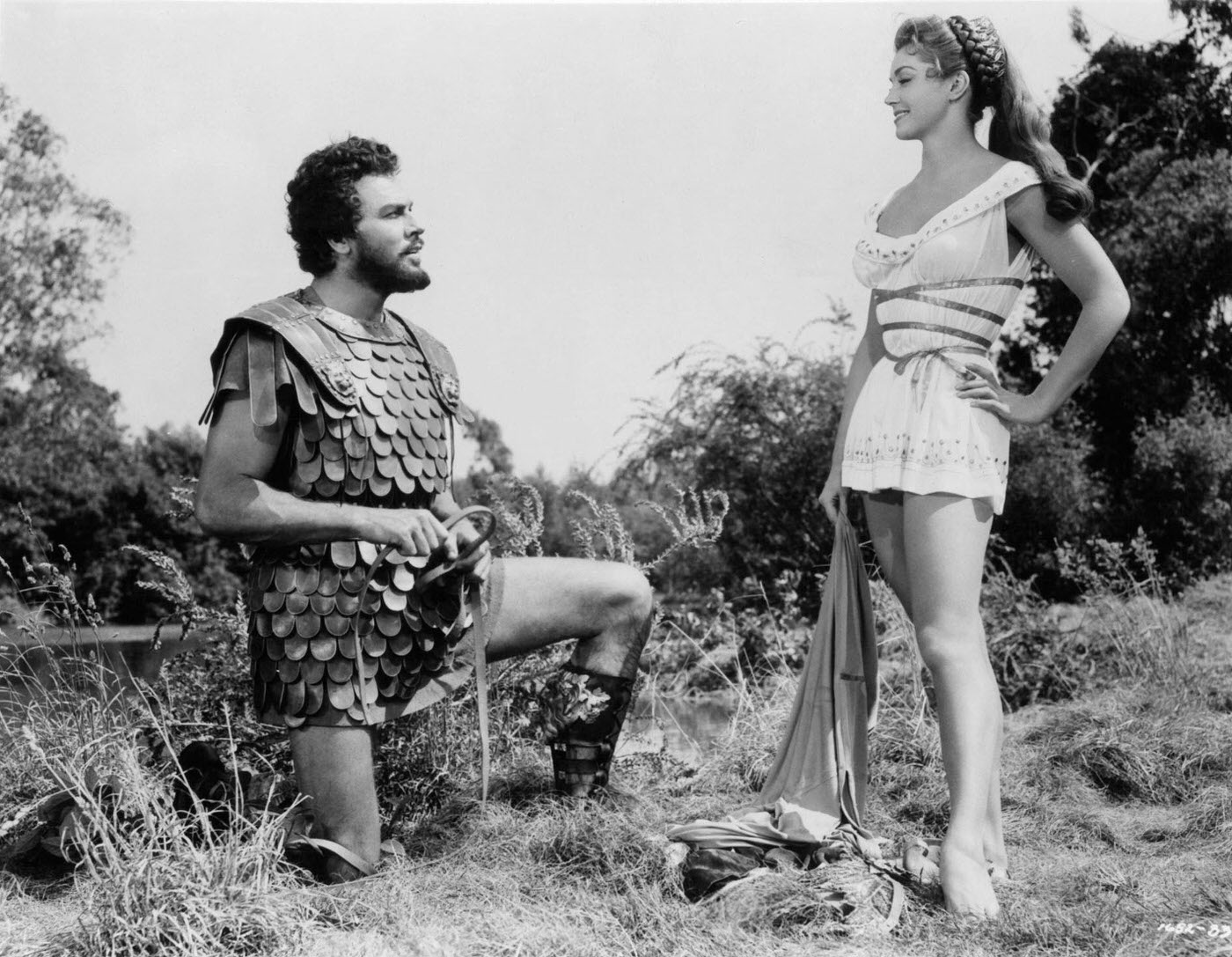 Howard Keel Kneeling Before Esther Williams In A Scene From The Film 'Jupiter'S Darling', 1955.