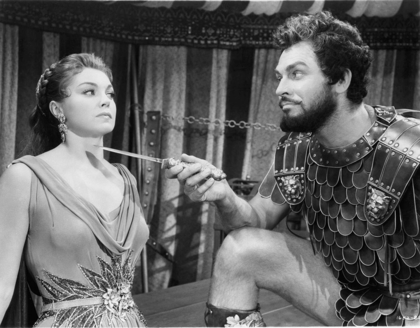 Howard Keel Points Knife At The Neck Of Esther Williams In A Scene From The Film 'Jupiter'S Darling', 1955.