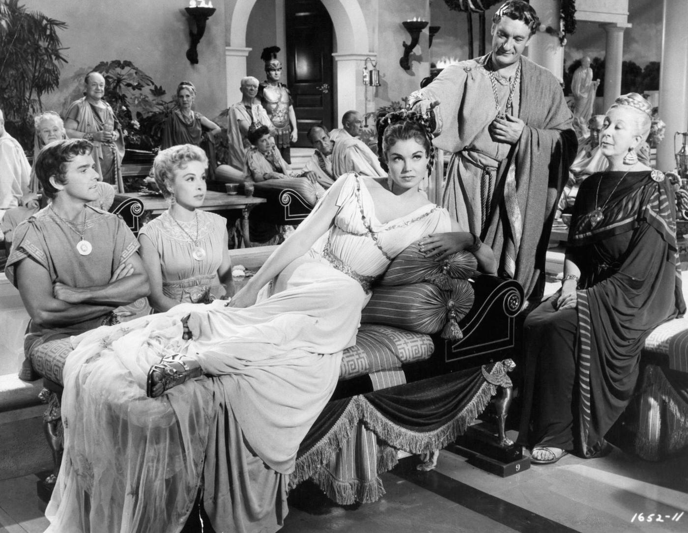 Gower Champion, Marge Champion, Norma Varden Watch Esther Williams Getting Pointed At By George Sanders With In A Scene From The Film 'Jupiter'S Darling', 1955