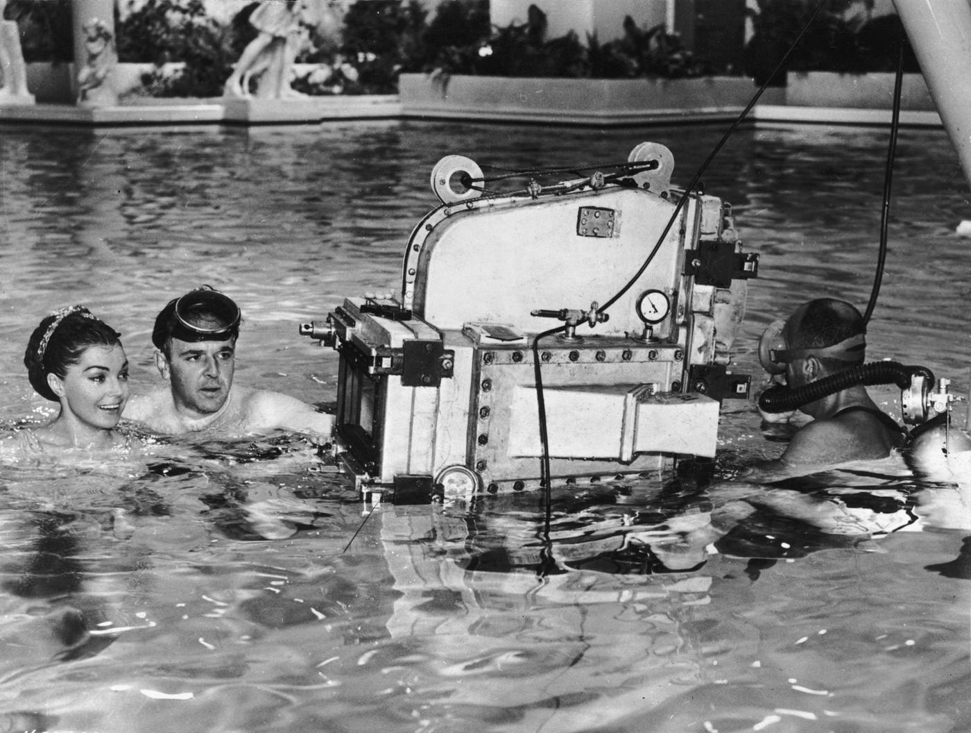 George Sidney Wears A Diving Mask While Directing American Swimmer And Actor Esther Williams In A Swimming Pool On The Set Of His Film, 'Jupiter'S Darling'.