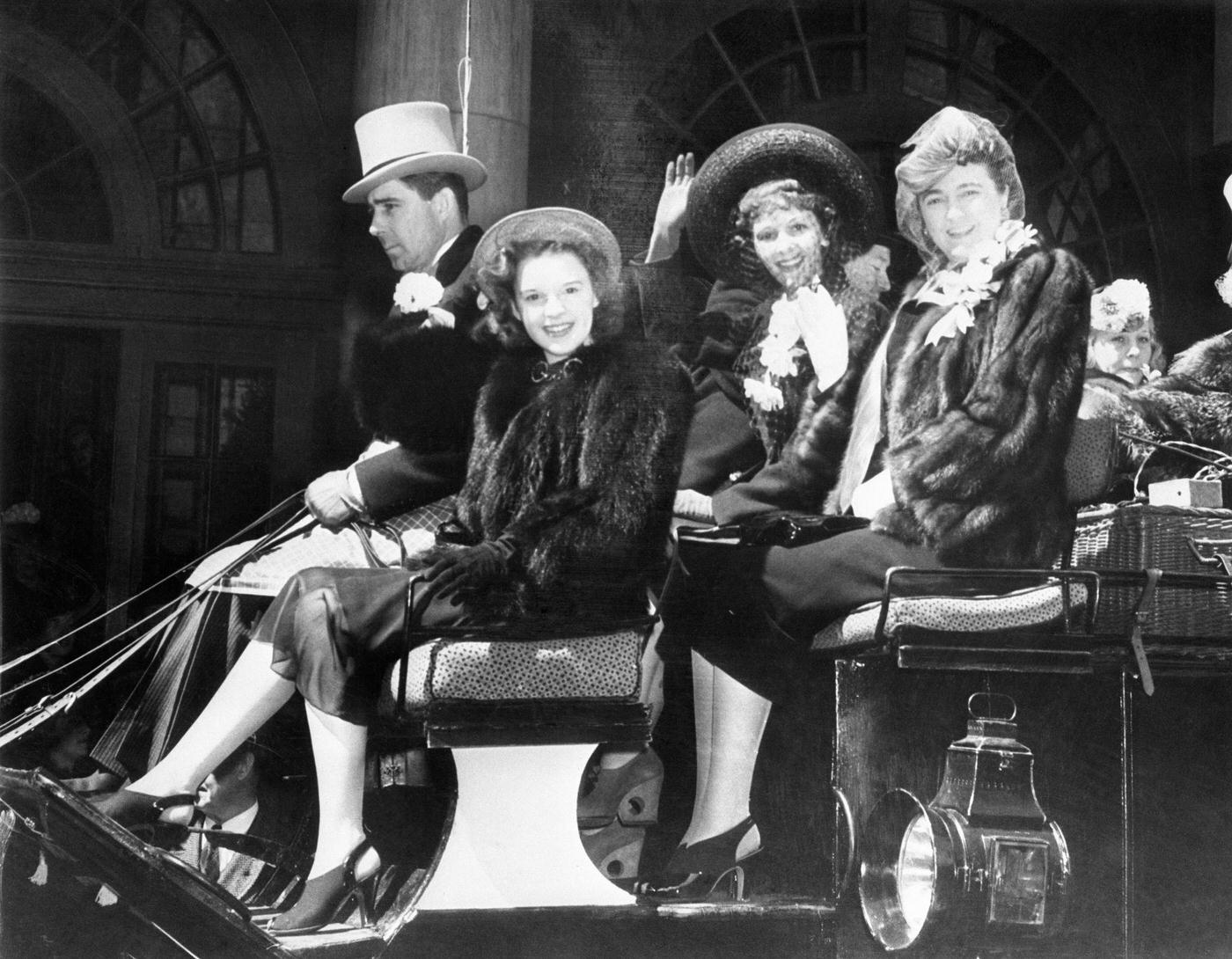 Frank Carroll, Sportsman, Drives The Traditional Easter Coach Down Fifth Avenue Accompanied By Judy Garland, Screen And Radio Singing Star; Mary Martin, Of Stage Fame, And Vyvyan Donner,
