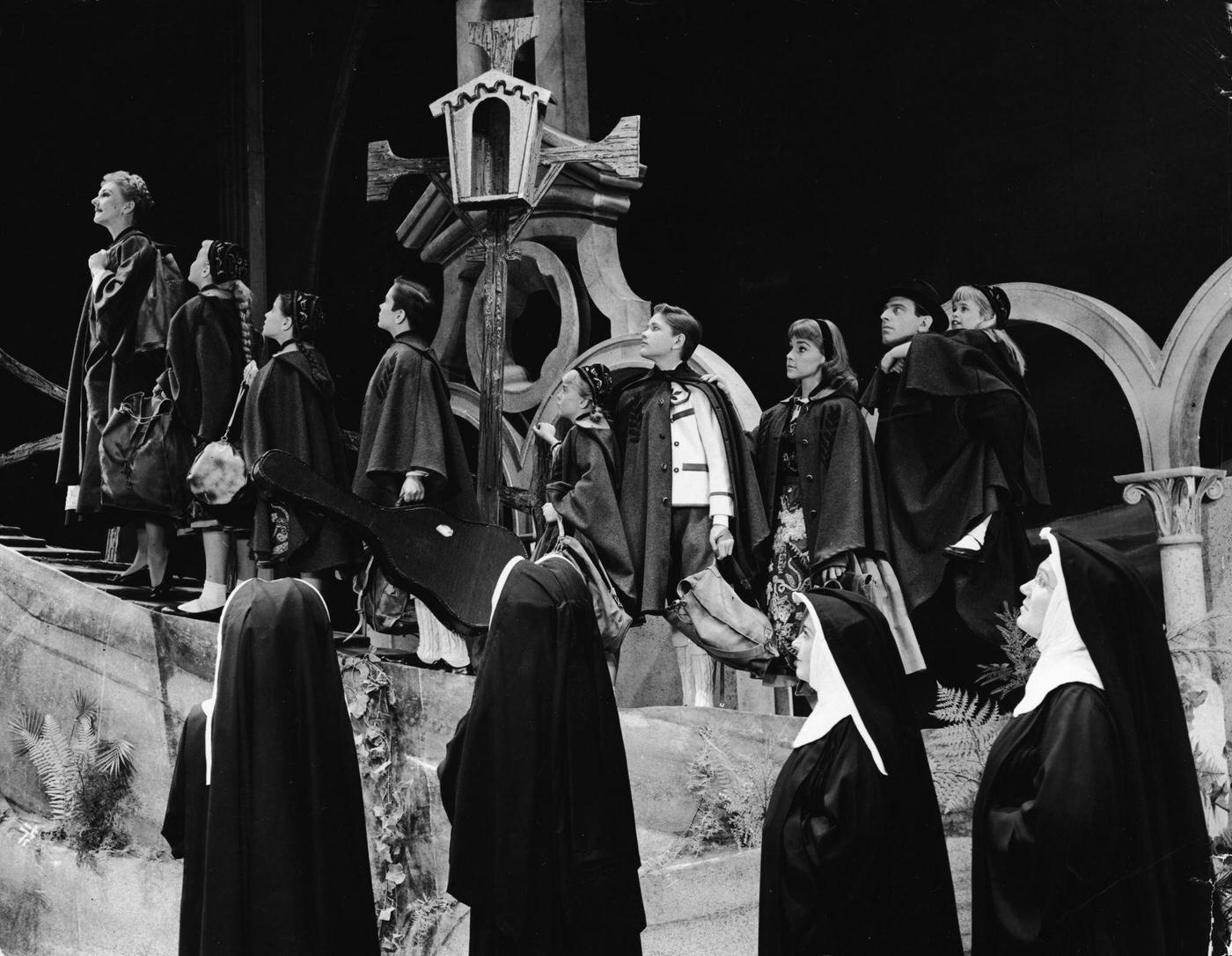 Mary Martin Leads A Group Of Children And Actor Theodor Bikel Up A Slope As Nuns Look On In The Scene Where The Von Trapp Family Flees Austria In Rodgers &Amp;Amp; Hammerstein'S Broadway Play, 'The Sound Of Music,' 1959