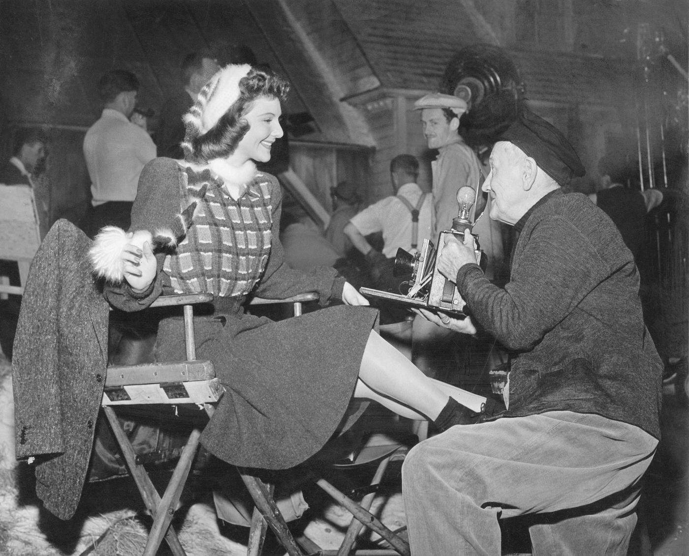 A Photographer Kneels Down To Snap Mary Martin, 1940