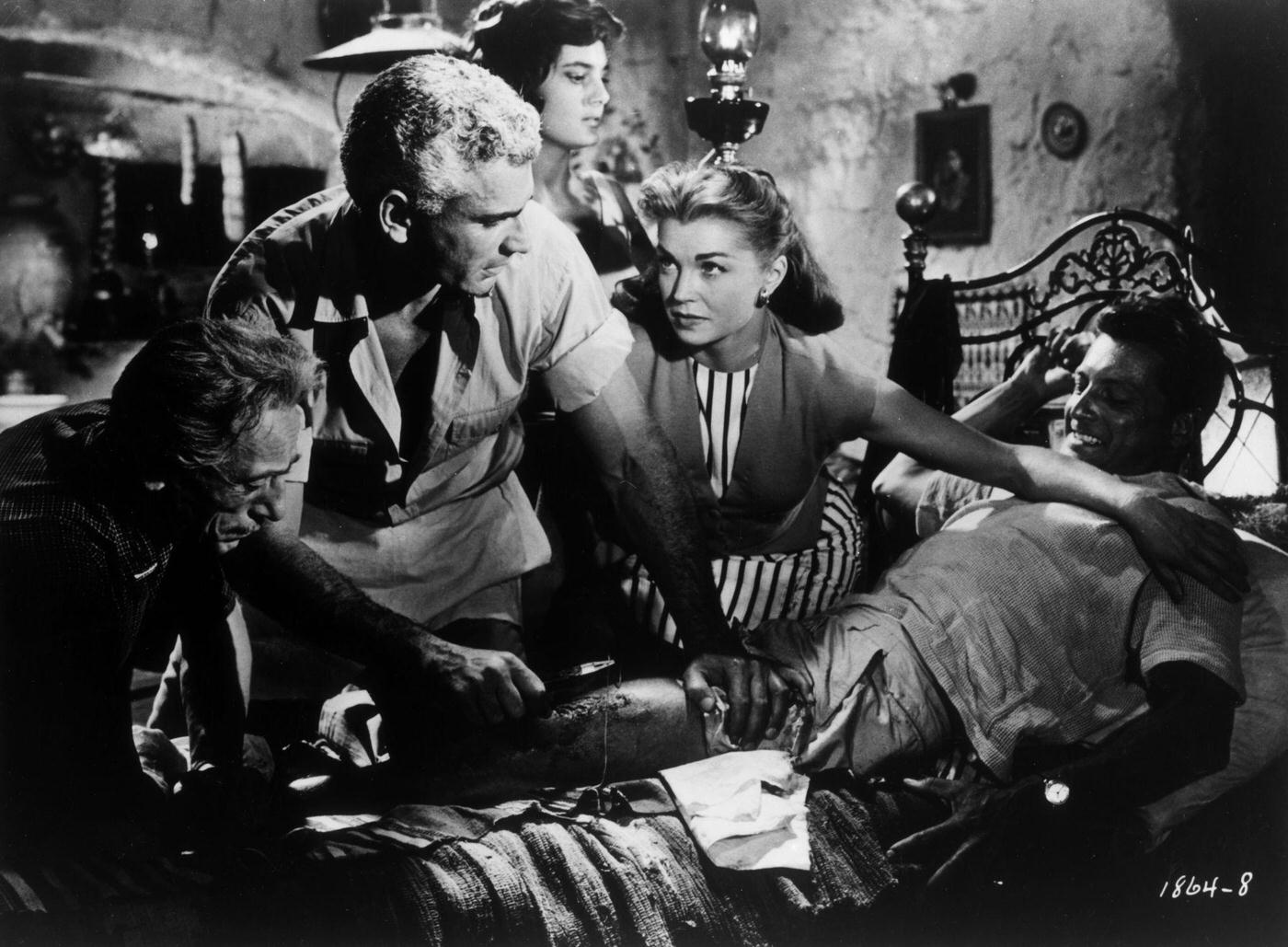 American Actors Jeff Chandler And Esther Williams Offer Medical Assistance To A Man With A Leg Wound While Italian Actors Eduardo De Filippo And Rossana Podesta, 1958