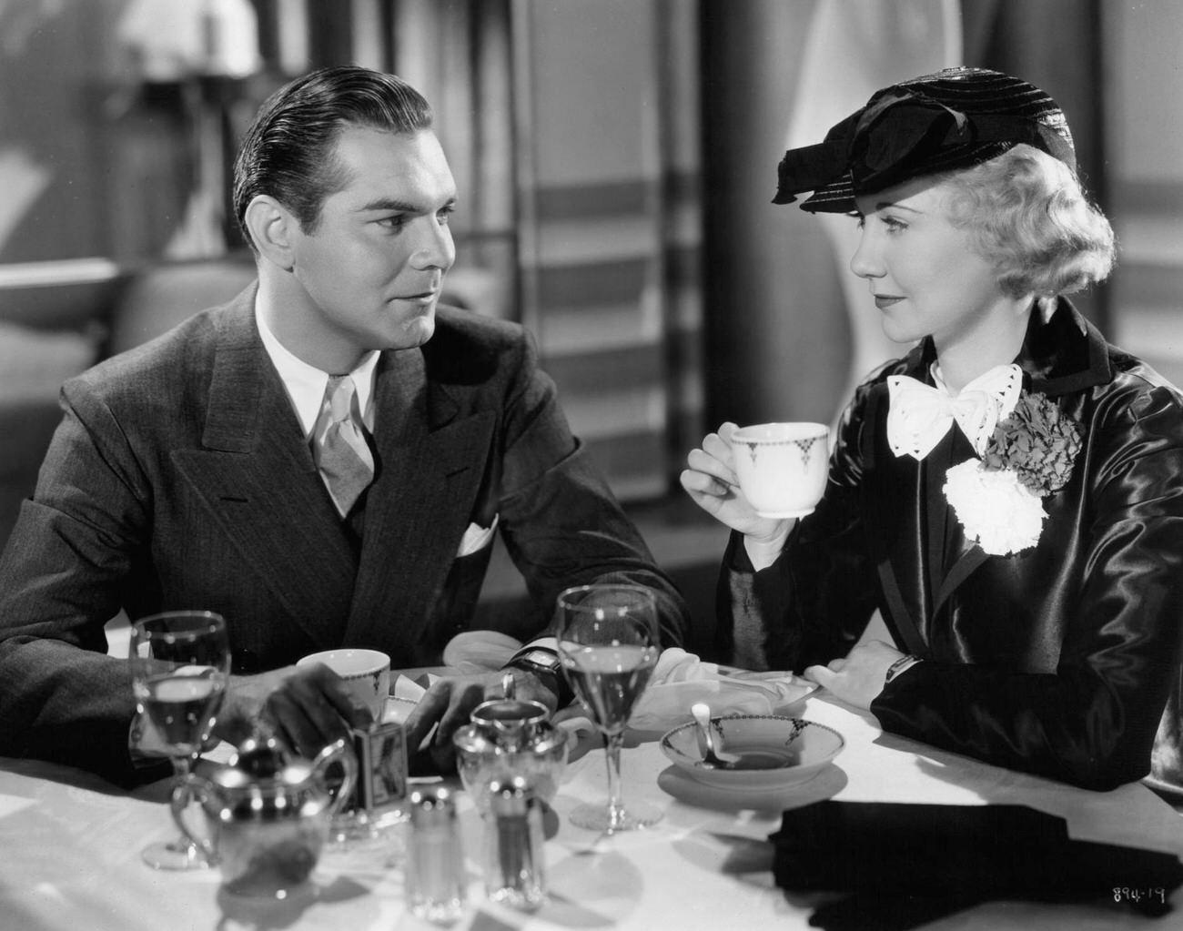Una Merkel Having Coffee With Unidentified Man In A Scene From The Film 'Speed', 1936.