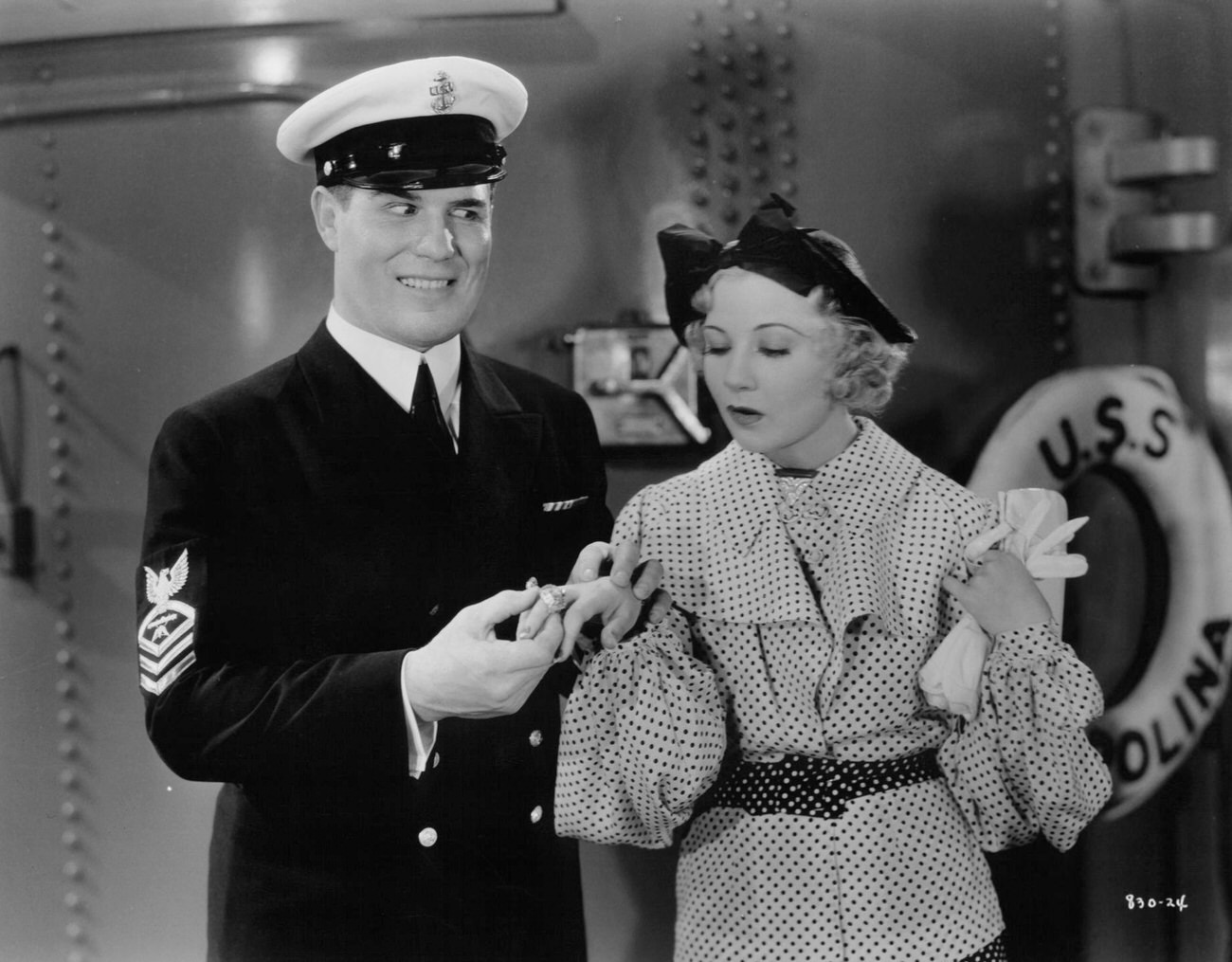 Robert Taylor Places Ring On Finger Of Una Merkel In A Scene From The Film 'Murder In The Fleet', 1935.