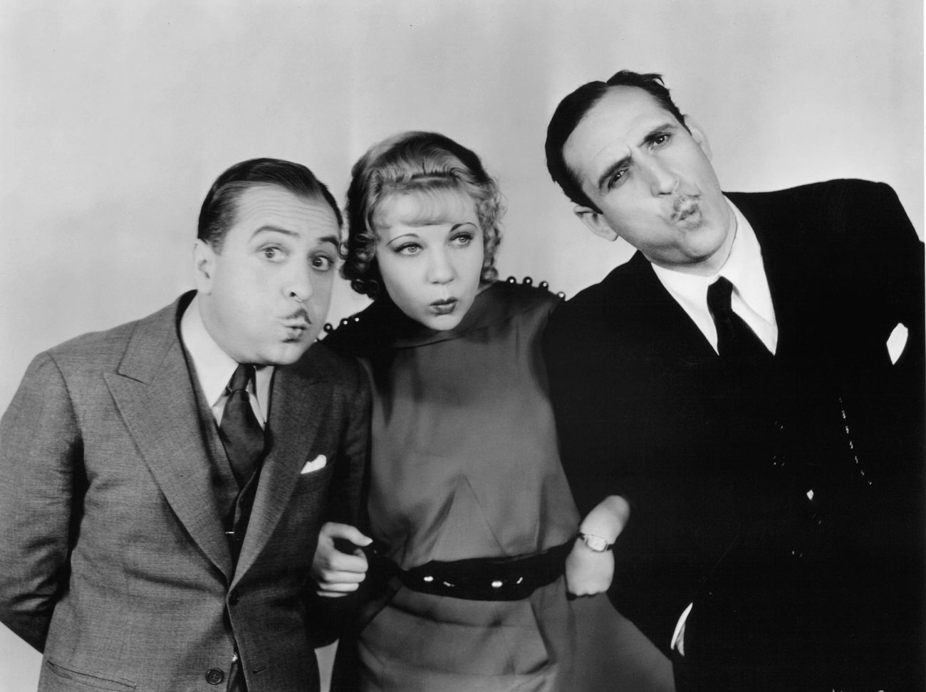 Una Merkel Standing Between Two Men As They All Whistle In A Scene From The Film 'Whistling In The Dark', 1933.