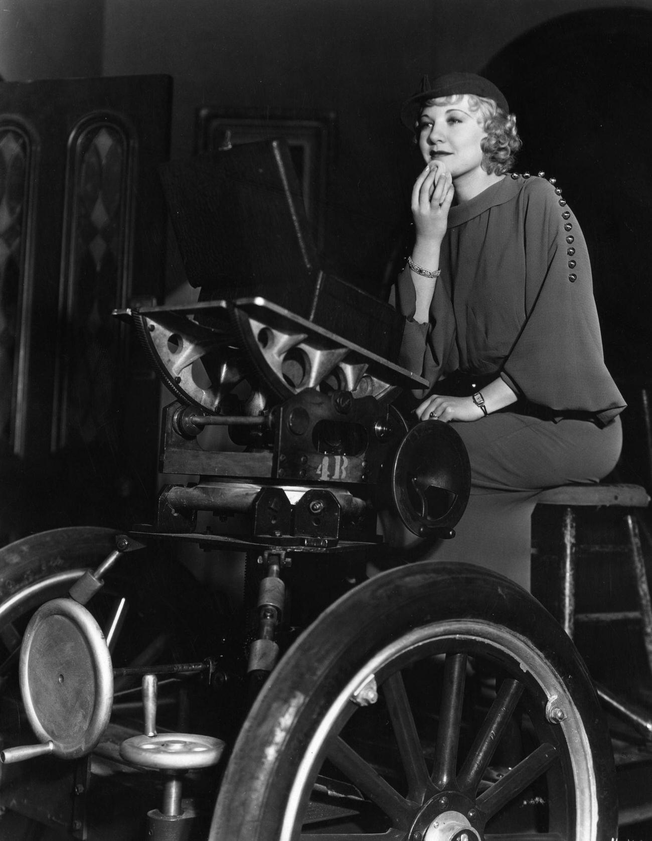 Una Merkel Using The Camera Dolly To Rest Her Mirror On While Touching Up Her Make Up Between Scenes On The Set Of 'Whistling In The Dark'.