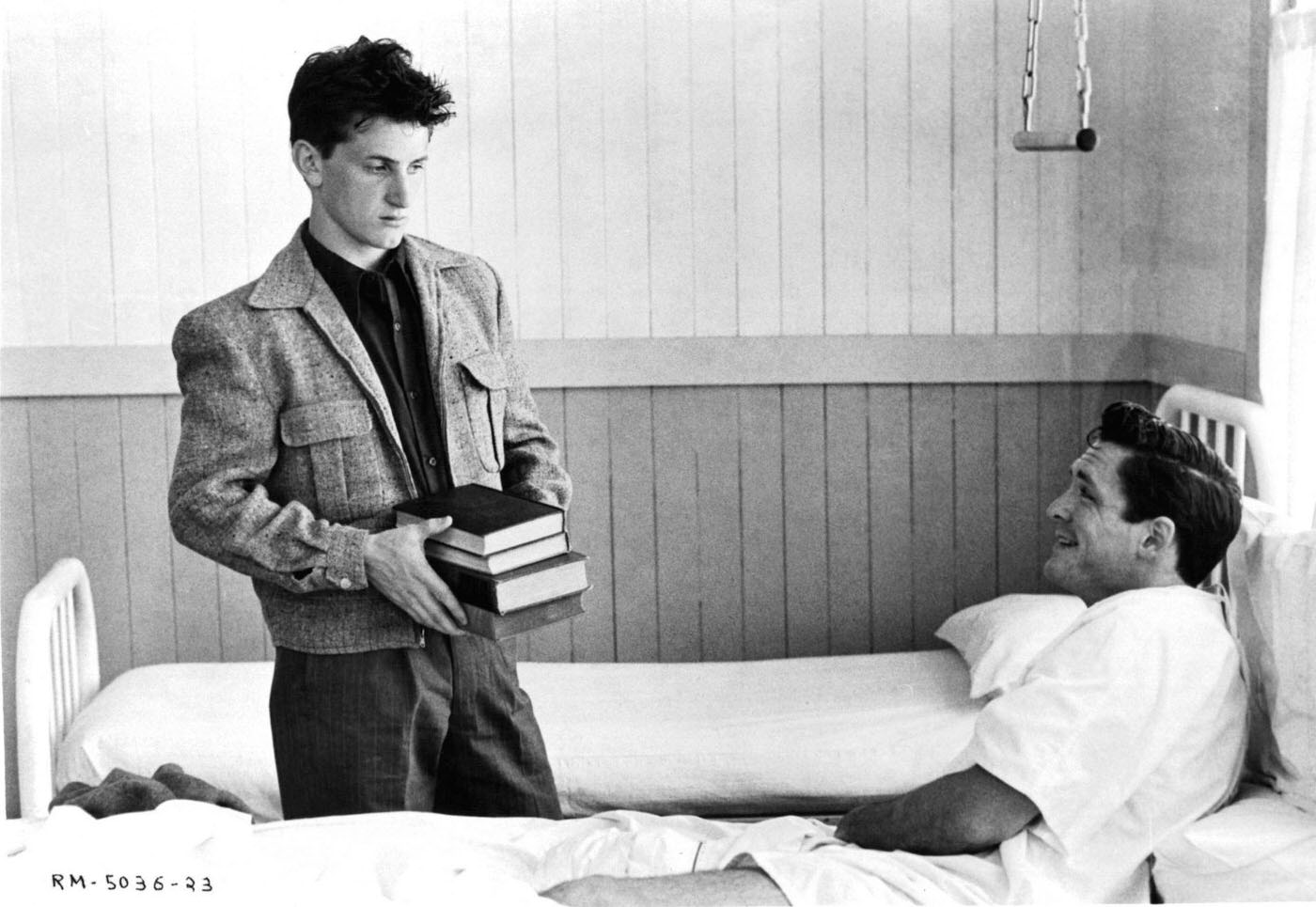 Sean Penn Brings Books To A Boy In The Hospital In A Scene From The Film 'Racing With The Moon', 1984.