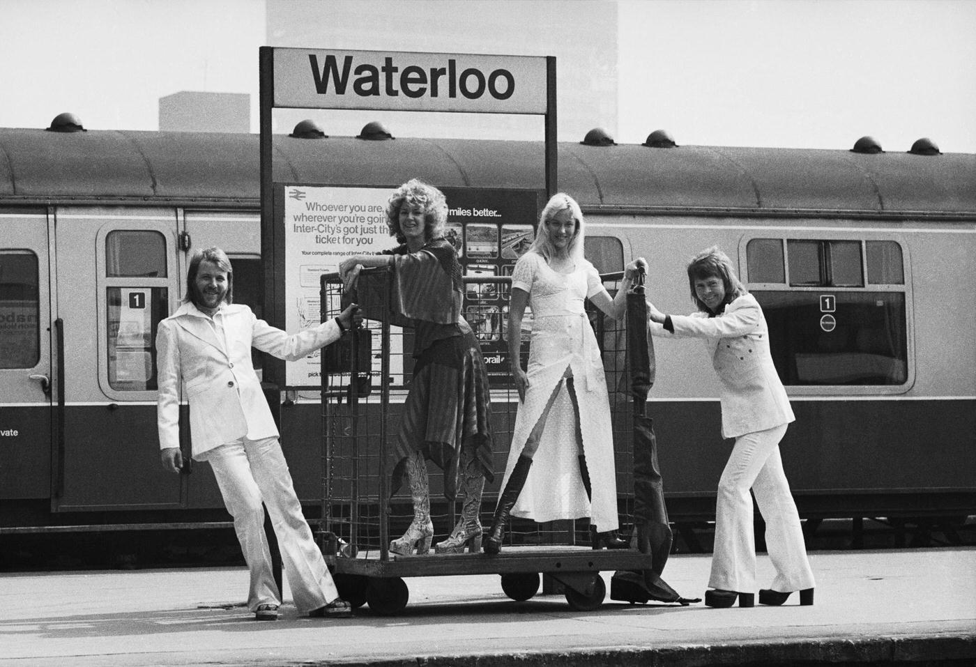 Benny Andersson, Anni-Frid Lyngstad, Agnetha Faltskog And Bjorn Ulvaeus Of The Swedish Pop Group Abba Posing At Waterloo Railway Station, 1974