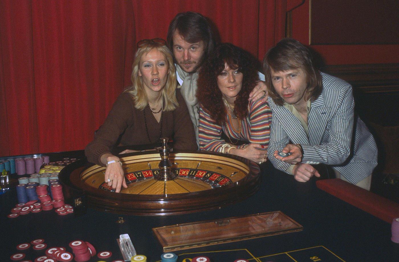 Abba (L-R) Agnetha Faltskog, Benny Andersson, Anni-Frid Lyngstad And Bjorn Ulvaeus, Play Roulette During A Visit To London, 1974