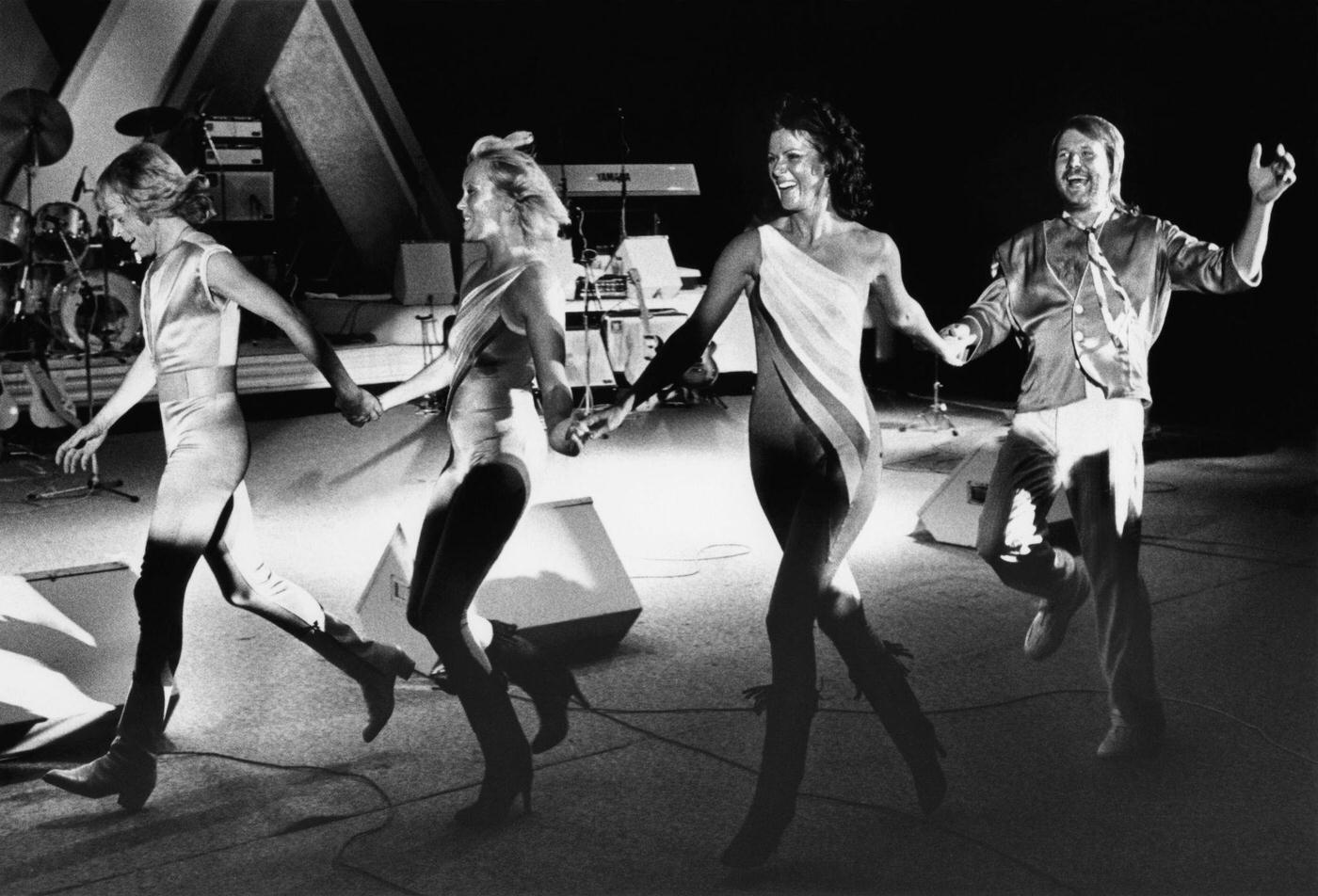 Bjorn Ulvaeus, Agnetha Faltskog, Anni-Frid Lyngstad And Benny Andersson Of The Pop Group Abba Dance Across The Concord Pavilion Stage During A Rare 1981 Concert In Walnut Creek, California.