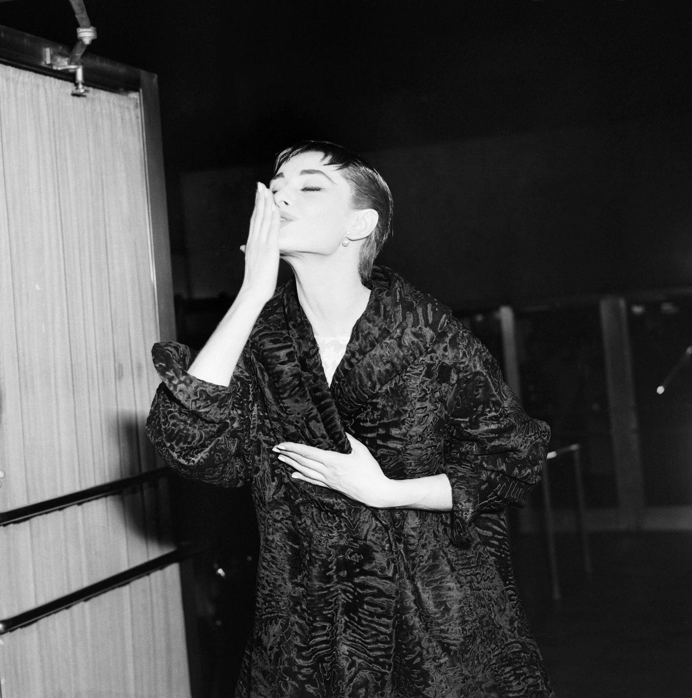Audrey Hepburn, In Complete Costume And Makeup, Throws A Kiss To The Crowd Gathered At New York'S Center Theater