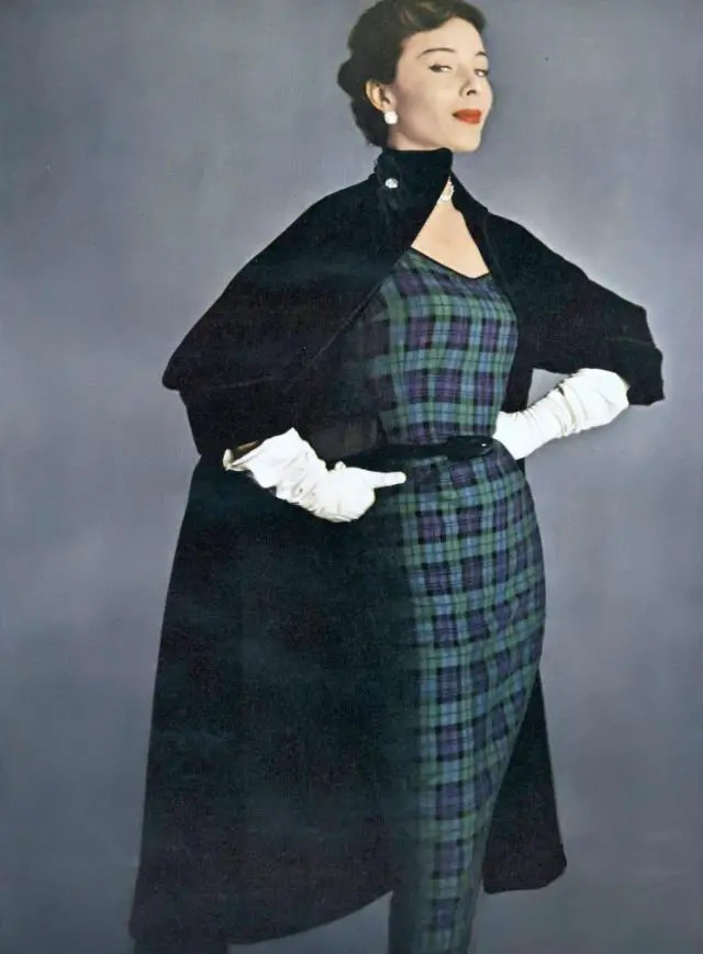 Bettina In Plaid Wool Worsted Sheath Under A Big Black Velveteen Coat Inter-Lined And Braid-Bound, Both By H. &Amp;Amp; D., Earrings By Kramer, Vogue, August 15, 1950