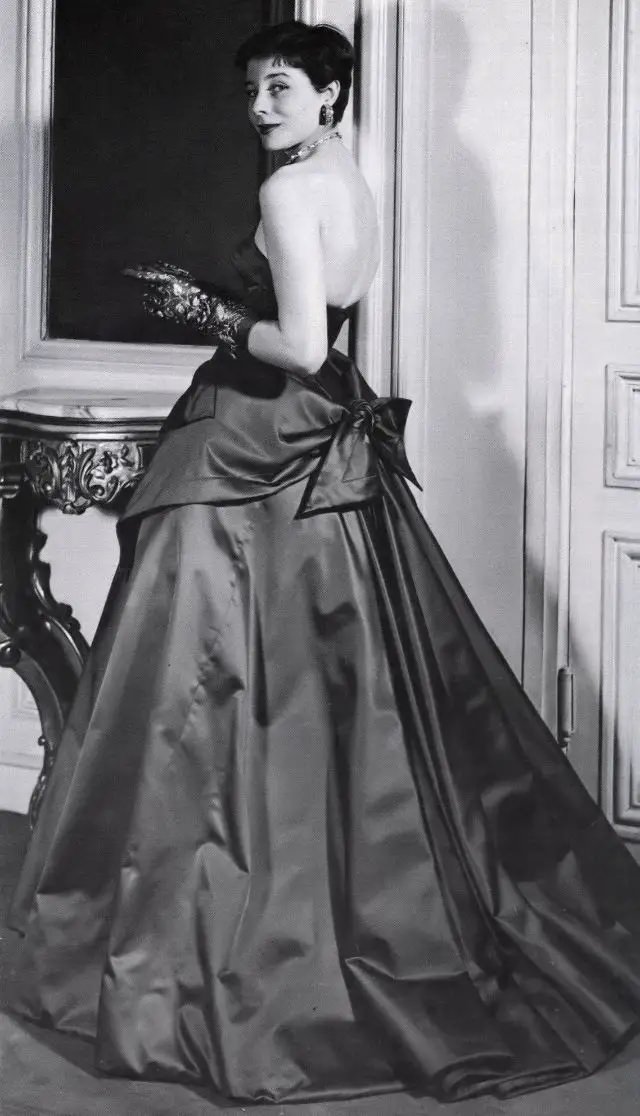 Bettina With Her Haircut ‘A La Zizi Jeanmaire’ Is Wearing Satin Evening Gown With Apron Effect By Jacques Fath, 1950