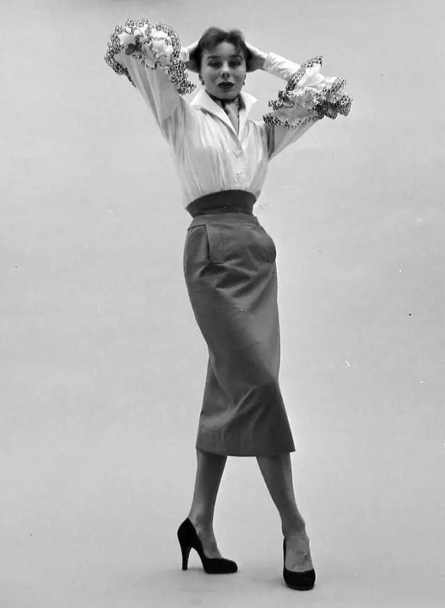 Bettina In Givenchy’s Cotton Blouse With Black Embroidered Ruffles Called “Blanchisseuse” (Washerwoman) Tucked Into A Slim Gabardine Skirt, February 1952