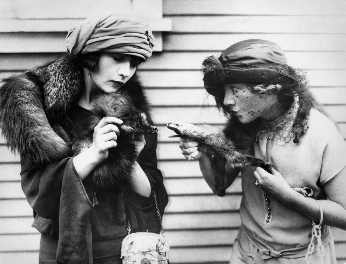 Kathleen Clifford And Betty Compson Stage A Mock Fight With Their Fur Stoles, 1920.
