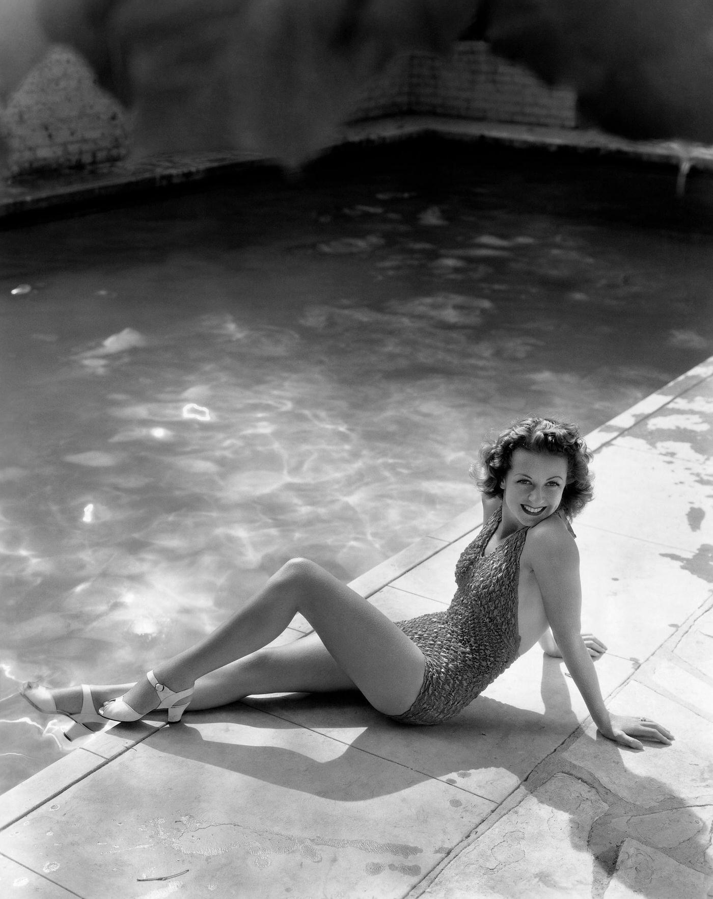 Danielle Darrieux Relaxes By A Swimming Pool Around The Time Of Her Appearance In The 1938 Movie The Rage Of Paris.