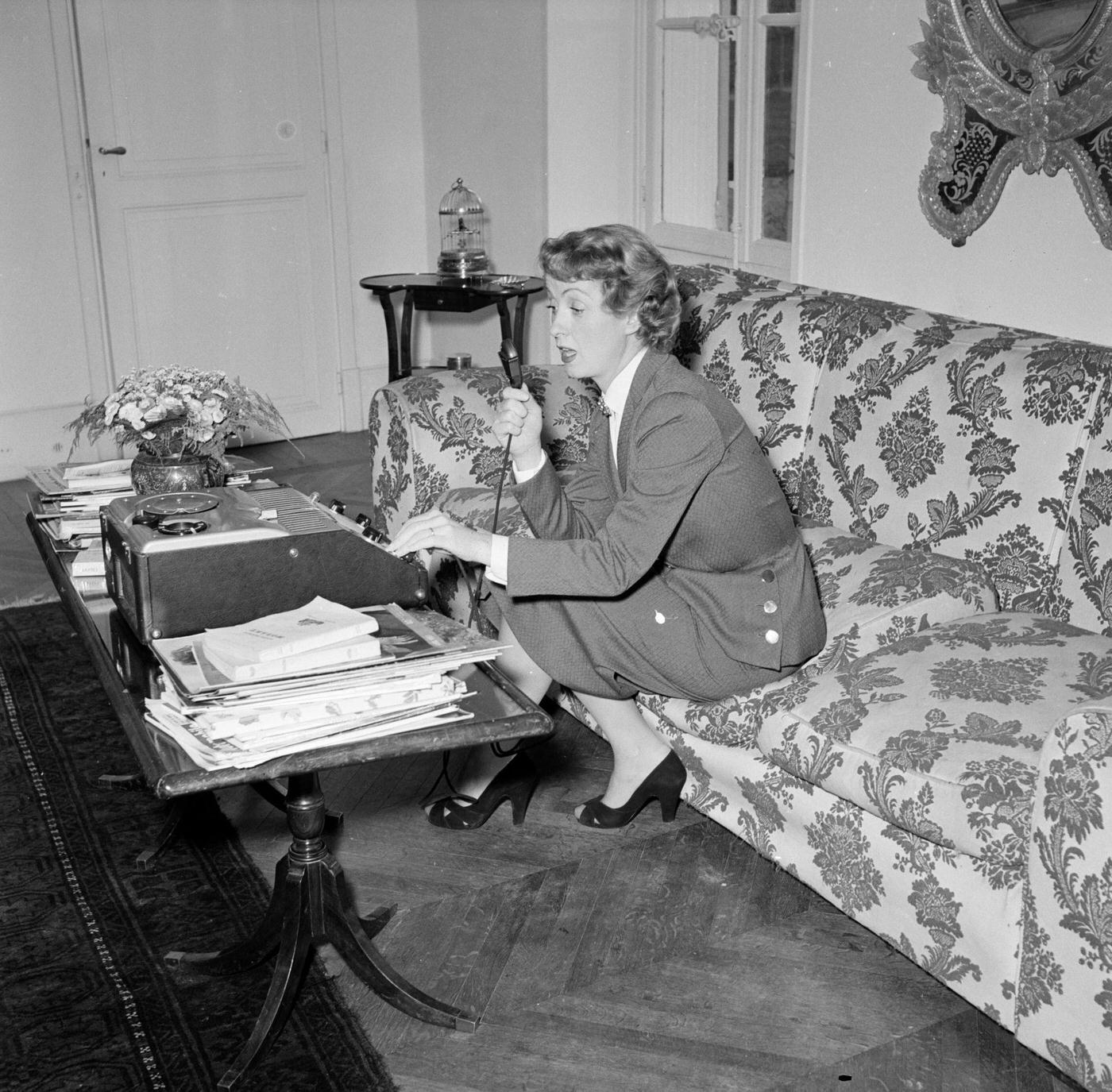 Danielle Darrieux At Home In Louveciennes, France, April 1951, Interviewed By Paris Match With A Reel-To-Reel Tape Recorder On The Coffee Table In Front Of Her.