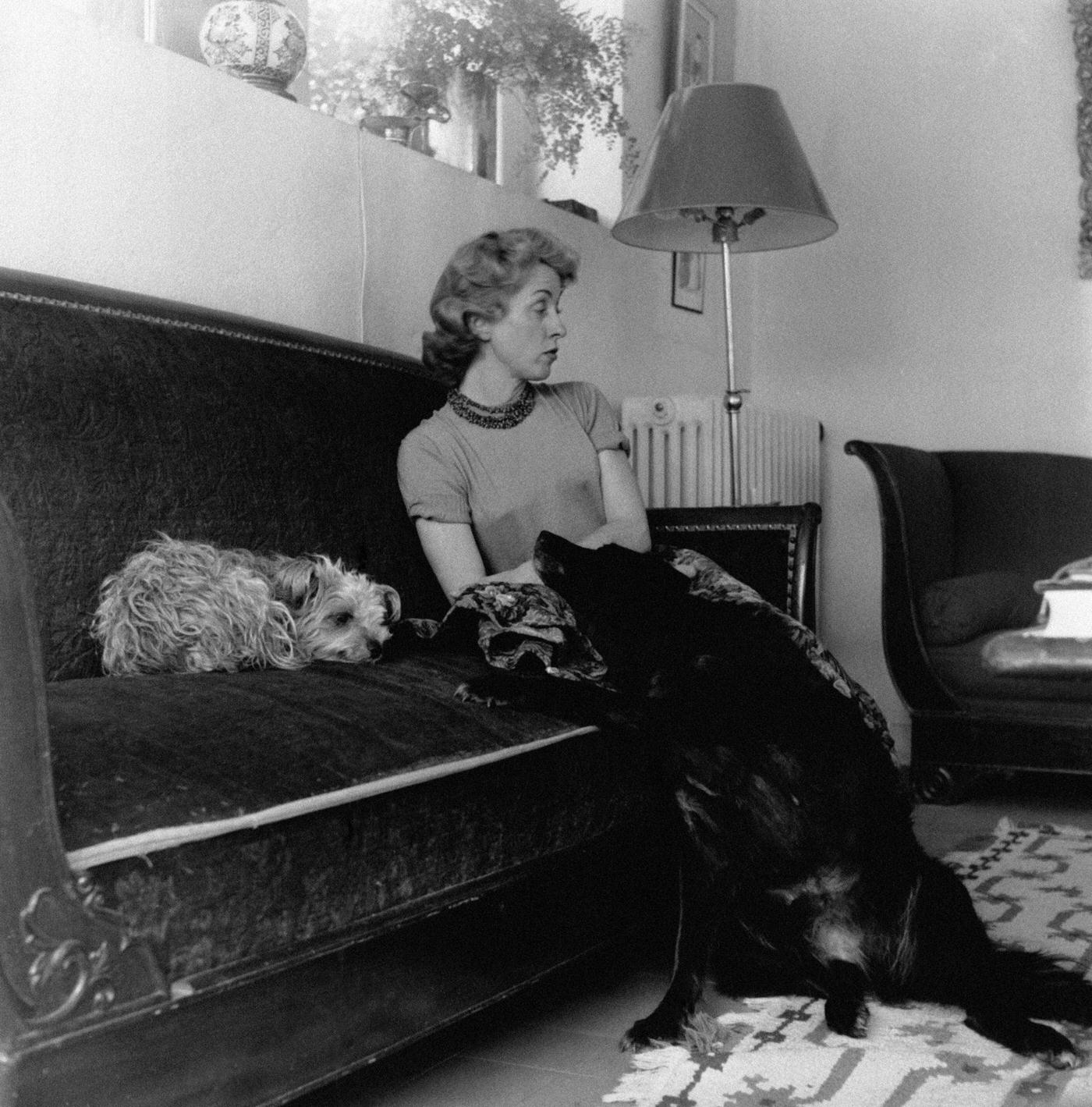Danielle Darrieux With Two Dogs At Her Home In Feucherolles, France, In 1950.
