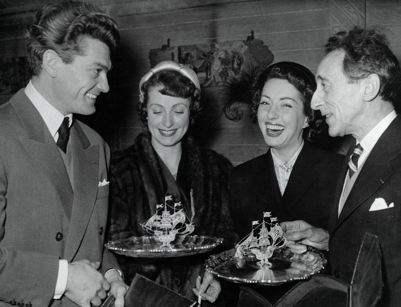 French Artist And Director Jean Cocteau (Right) With Jean Marais (Left), Danielle Darrieux, And Viviane Romance In Paris, Following Their Awards At The Lisbon Film Festival In 1949.