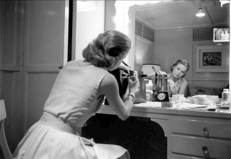 Grace Kelly In Her Dressing Room Adjusts Her Handbag By Hermès Named For Her (The Kelly Bag), During The Filming Of ‘High Society’, Hollywood, 1956