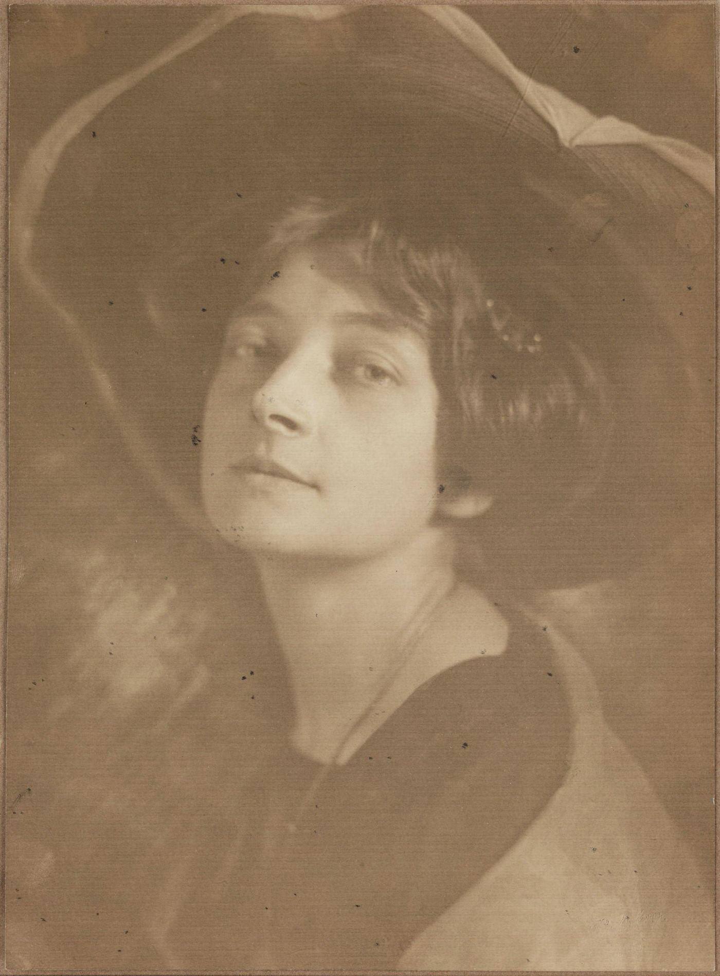 A Beautiful Edwardian Lady Wearing A Hat.