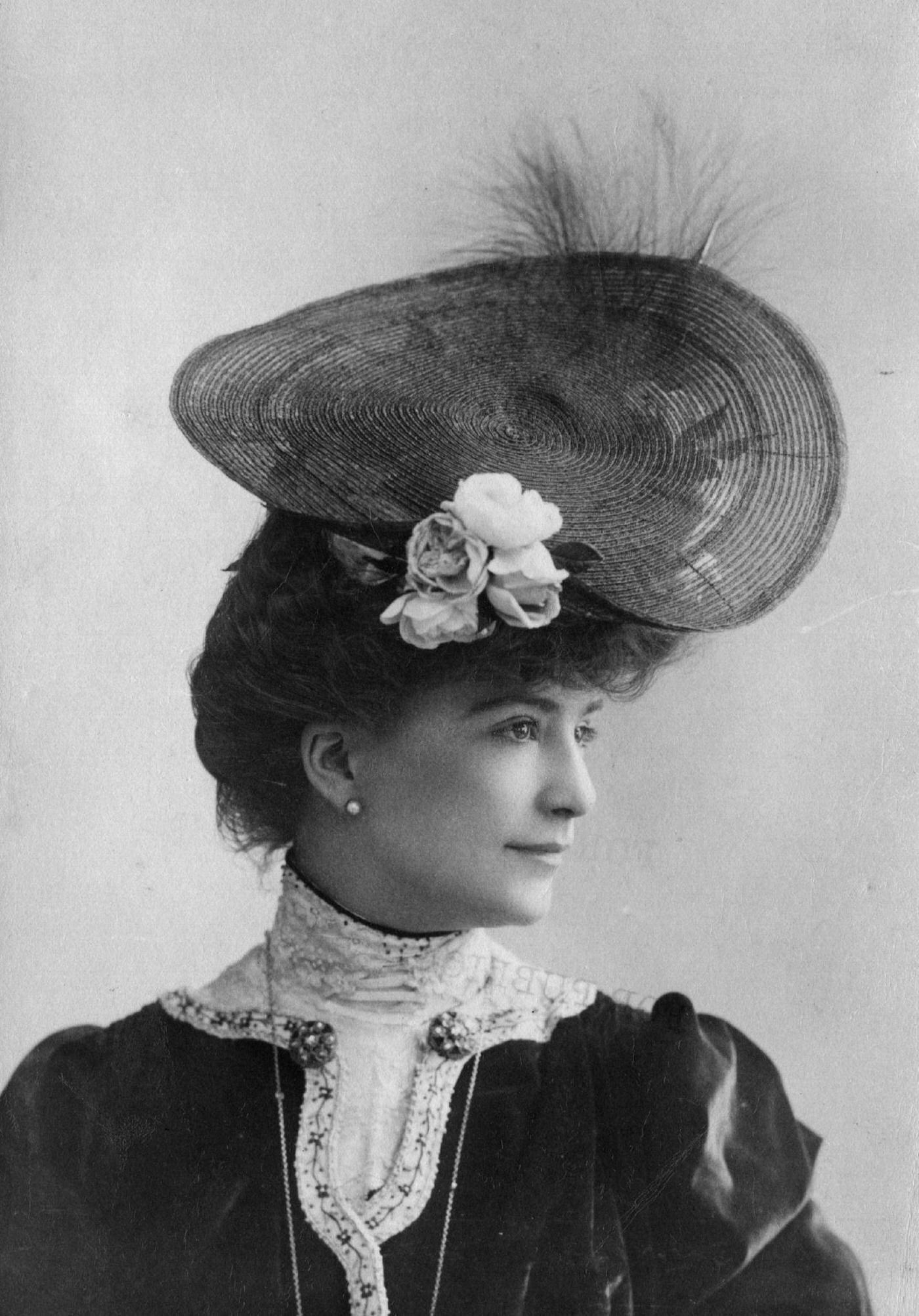 An Edwardian Woman Wearing A Circular Hat With Flower And Feather Trimming, 1903