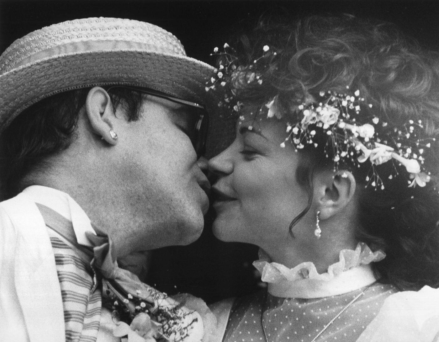 Elton John And Renata Blauel Kiss After The Couple At St. Marks Church