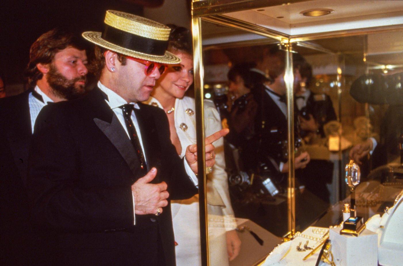 Alain-Dominique Perrin Shows The Cartier Exhibition To Elton John And His Wife Renate Blauel On January 3, 1985