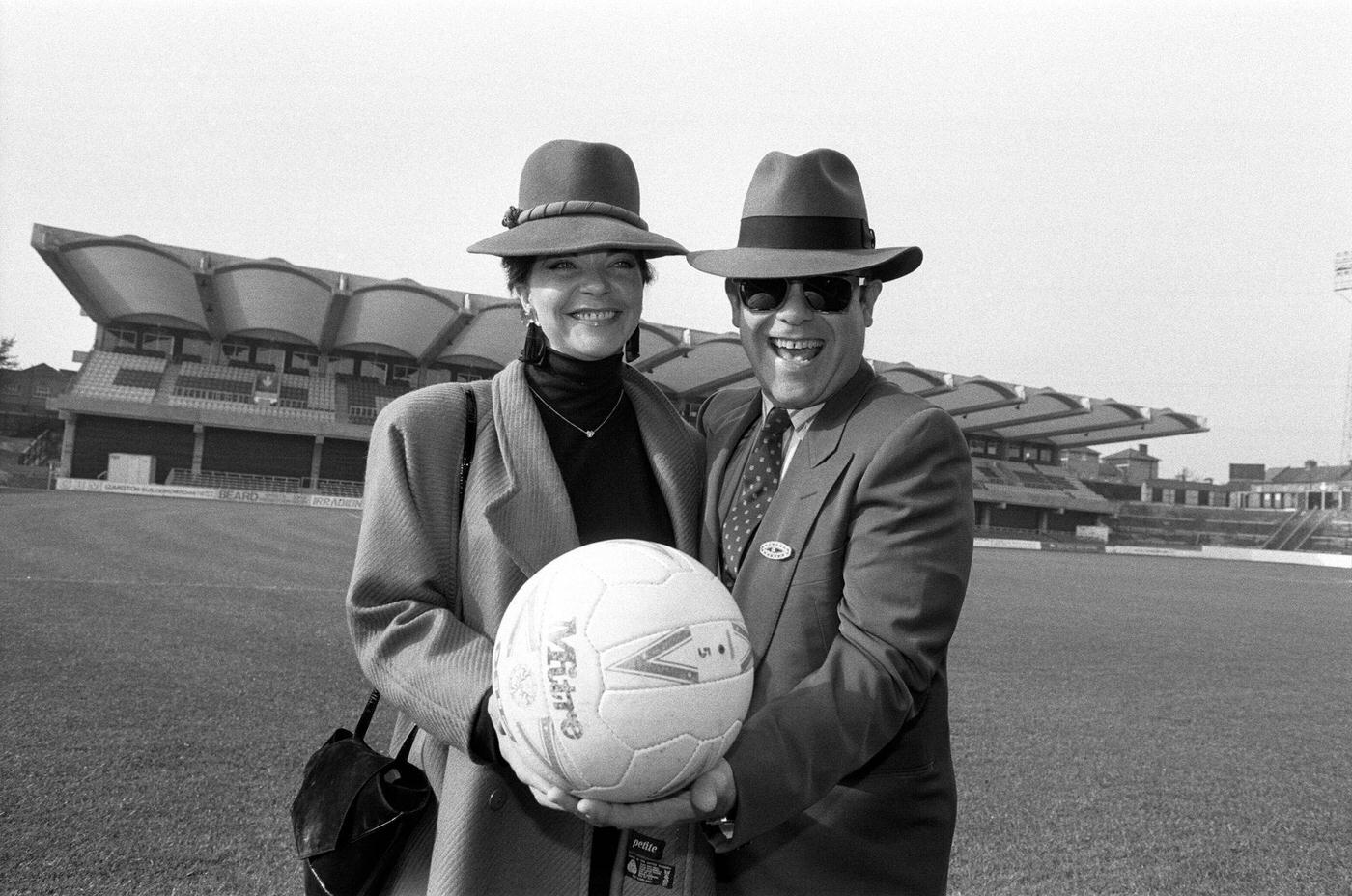 Elton John And Renate At Vicarage Road, Home Of Watford Football Club. Pictured In Front Of Watford'S New Stand, 18Th October 1986.