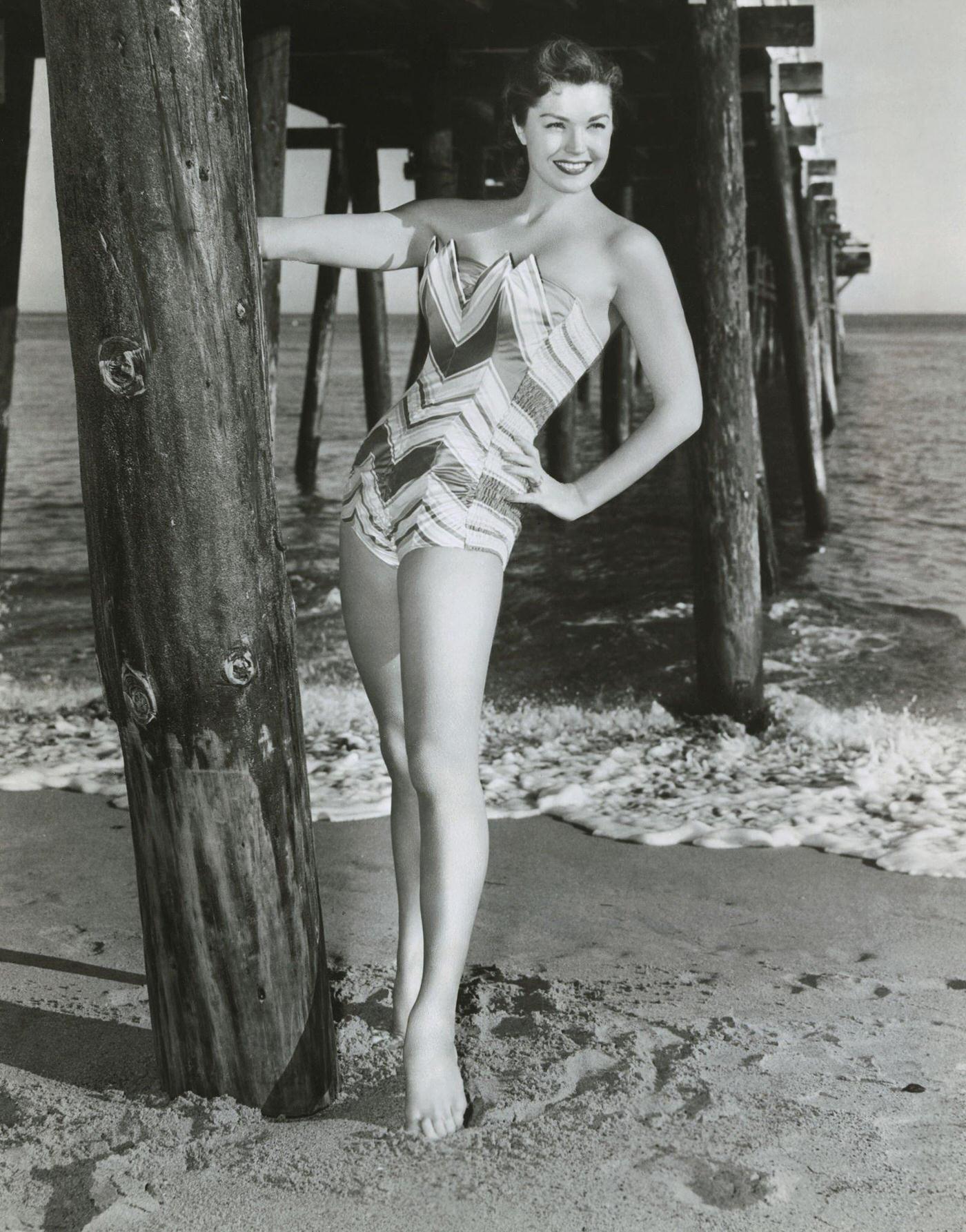 Esther Williams Posing In A Swimsuit. She Is Starring In Jupiter'S Darling In Which She Co-Stars With Howard Keel And Marge And Cower Champion.