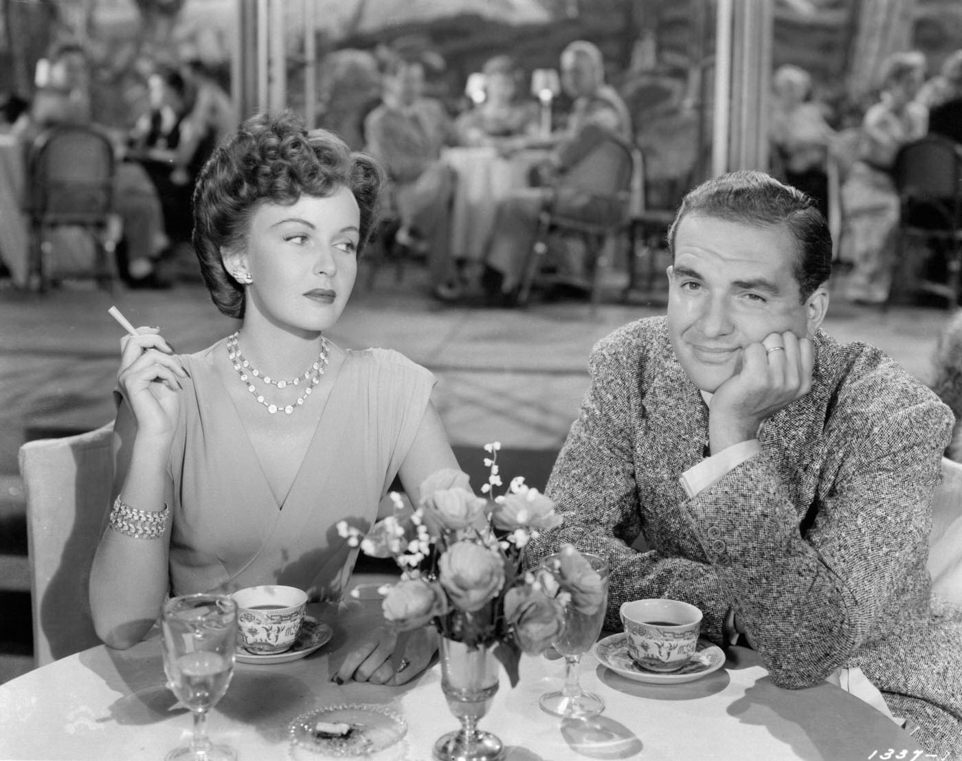 Esther Williams Looking Over At Donald Curtis At The Table In A Scene From The Film 'Thrill Of A Romance', 1945