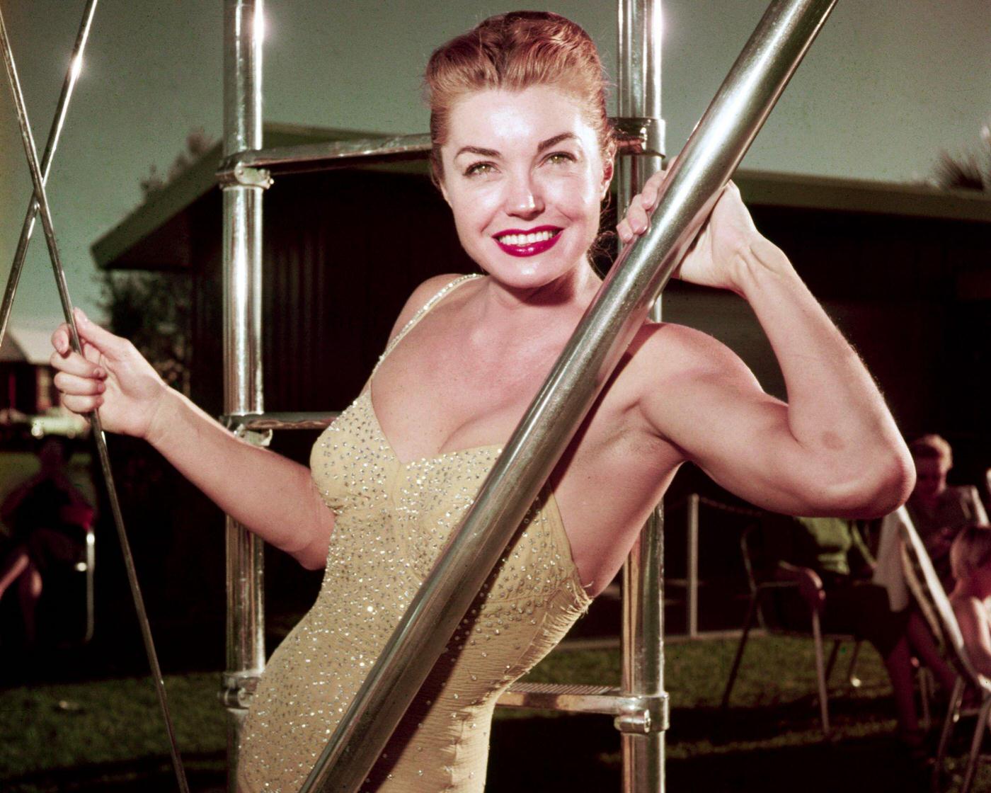 Esther Williams, In A Gold, Sequin Swimsuit, As She Poses Beside The Ladder To A Diving Board, Mid 1950S.