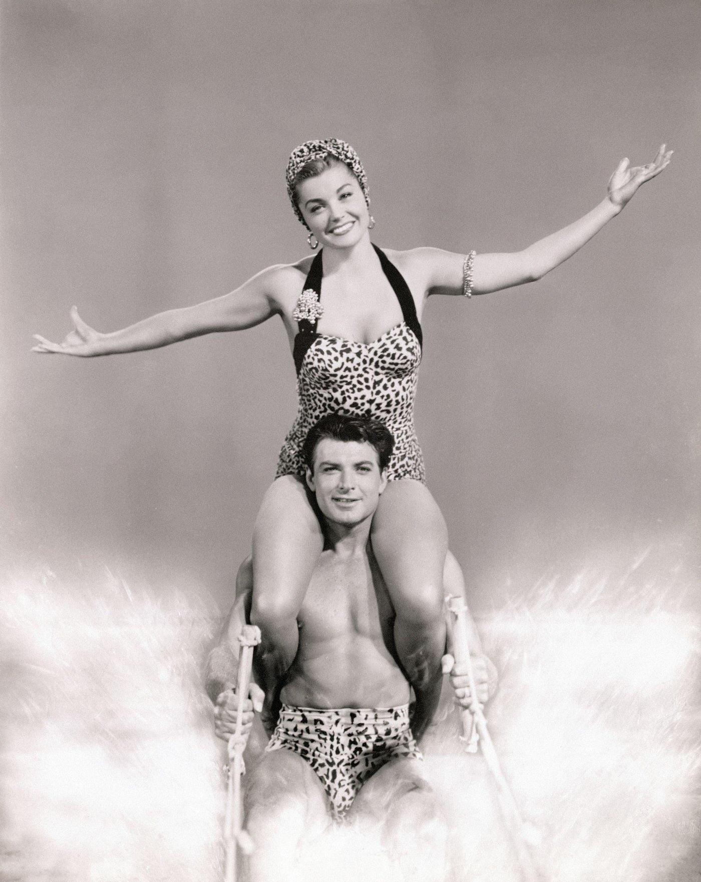 Esther Williams Sits Atop John Bromfield'S Shoulders To Water-Ski For Mgm'S Easy To Love. Filmed At Cypress Gardens, Florida.