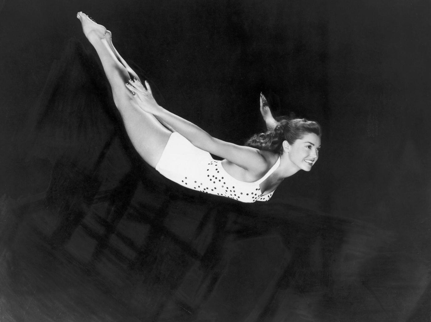 Esther Williams Diving Through The Air In A One-Piece Swimsuit, 1945
