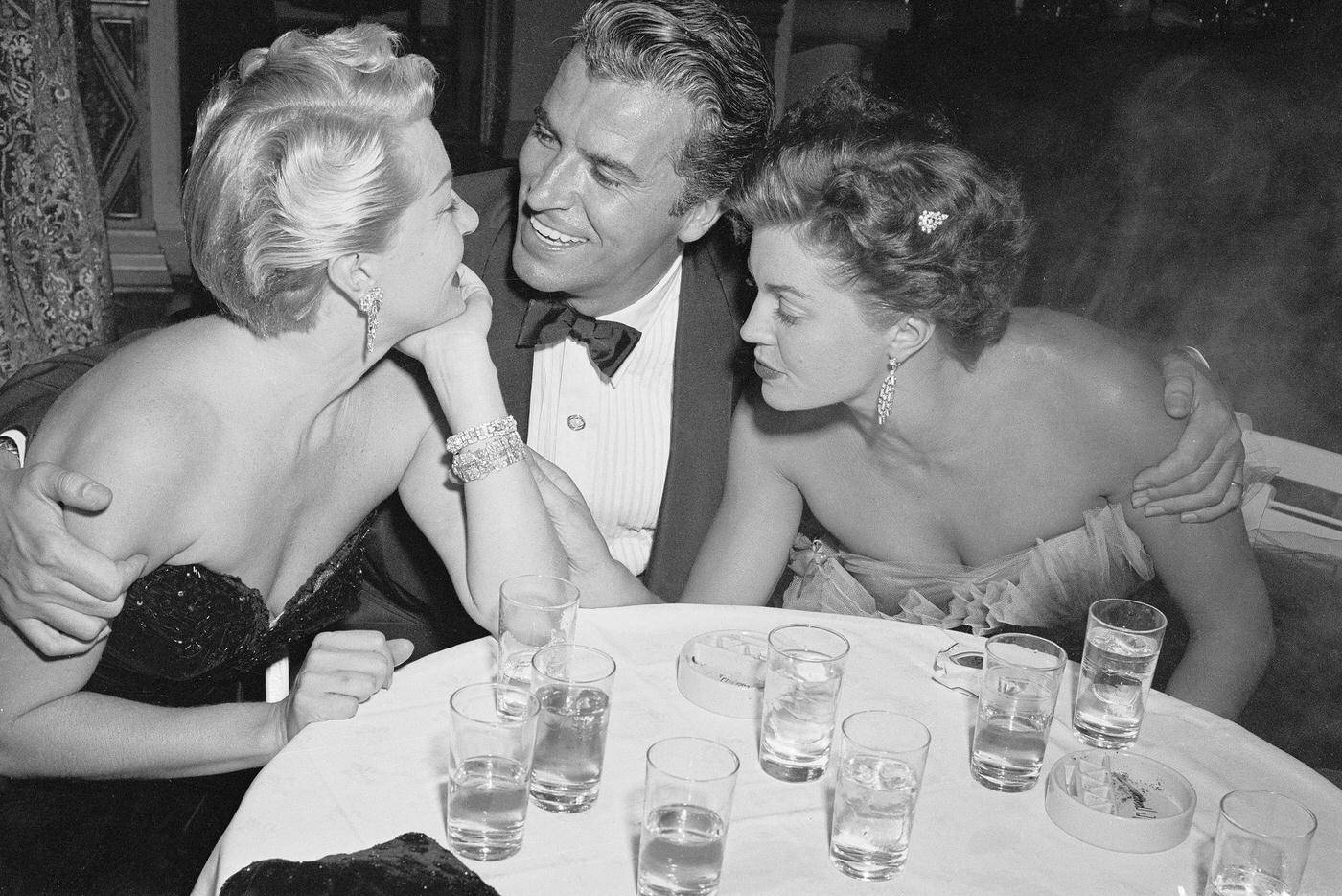 Lana Turner (Left) Seems To Have Eyes Only For Actor Fernando Lamas And Vice Versa, But Movie Actress Esther Williams Concentrates On Lana'S Sparking Bracelets.
