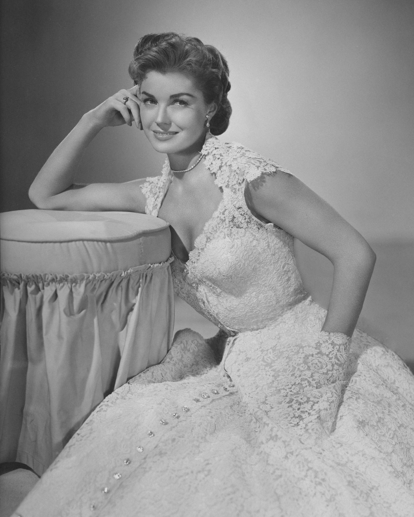 Esther Williams Wearing A Lacy Flowered Gown, Leaning On A Chair, 1945.
