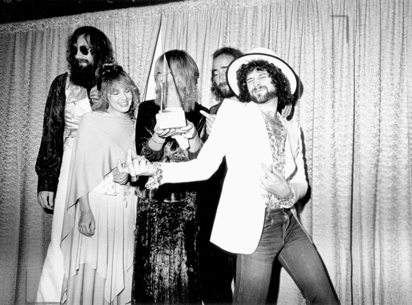 Fleetwood Mac (L-R Mick Fleetwood, Stevie Nicks, Christine Mcvie, John Mcvie And Lindsey Buckingham) Pose For Photographers Backstage At The 5Th American Music Awards Held At The Santa Monica Civic Auditorium, 1978