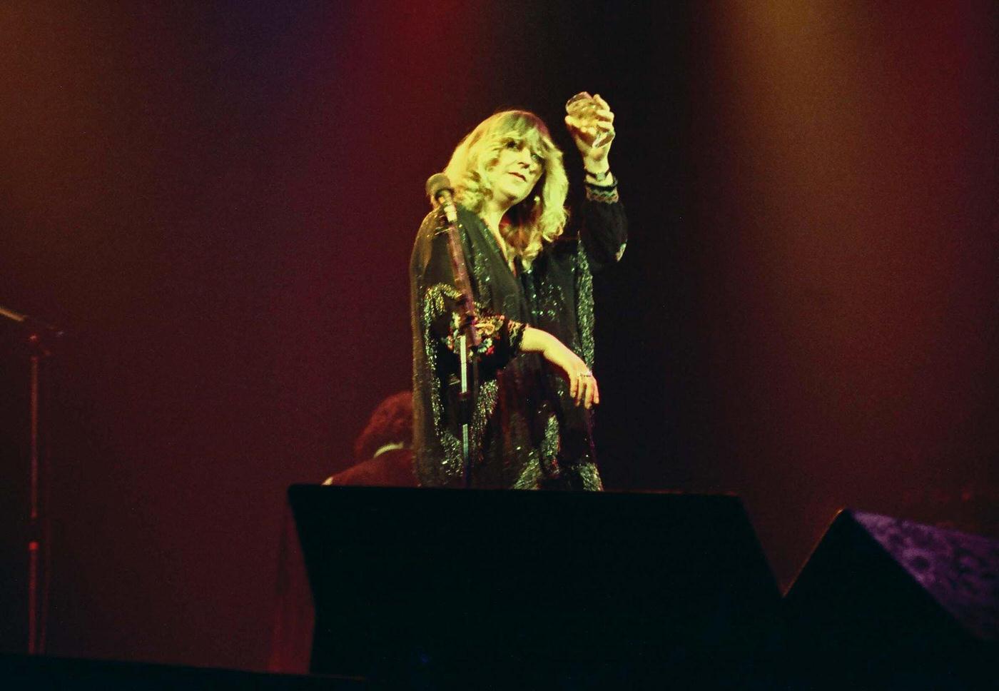 Christine Mcvie Of Fleetwood Mac Toasts The Audience After The Band'S Performance On Stage At The Glasgow Apollo, On April 4Th, 1977 In Glasgow, Scotland.