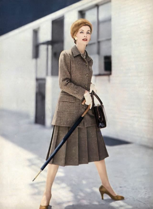Georgia Hamilton In Amber Tweed Suit With Jacket That Can Be A Coat, With Pale-Amber Crêpe Blouse, By Handmacher, Beret By Emme, Gucci Umbrella, Koret Bag, Vogue, September 1, 1955